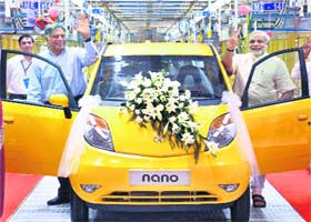 Gujarat Chief Minister Narendra Modi and Tata Group chairman Ratan Tata prepare to enjoy a ride in a Nano car at the inauguration of the car's Sanand plant near Ahmedabad