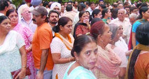 Relatives of six Delhi residents, who died in a road mishap in Ambala, gather outside the cremation ground at Punjabi Bagh in New Delhi.