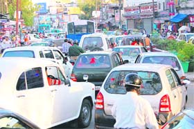 A scene of traffic on a road in Dehradun