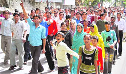 The trade union members take out a march in support of Shazebs family in Mussoorie on Wednesday.