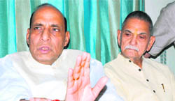 Former BJP president Rajnath Singh (left) and former union minister ID Swami address a press conference in Karnal on Wednesday.