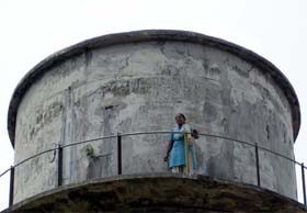 Former BJP councillor Shobha Rani atop a water tank of Civil Hospital in Pathankot