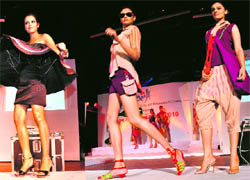 Models display creations of NIIFT students during their annual fashion show at the Tagore Theatre