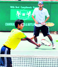 Players in action during a tennis match in Chandigarh on Thursday