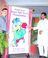 Uttarakhand Agriculture Minister Trivendra Singh Rawat unveils the mascot of South Asian Junior Table Tennis Championships in Dehradun on Thursday.