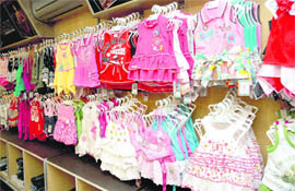 Summer dresses for children on sale at a showroom in Dehradun. 