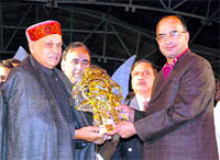 Chief Minister Prem Kumar Dhumal being presented a memento by deputy commissioner J.S.Rana on the occasion of Summer Festival at Shimla 