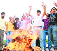 Members of the National Secular Forum protest on the Jammu University campus against the functioning of the State Public Service Commission on Thursday.