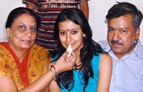 Madhuri Pushkarna with her parents