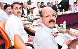 Civil Aviation Minister Praful Patel and Civil Aviation DG Nasim Zaidi (extreme right) at a meeting in New Delhi on Thursday.