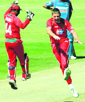 Zimbabwe players celebrate the wicket of Virat Kohli on Thursday.