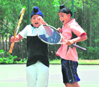 Sumit Pal Singh (left) and Paramveer Singh Bajwa in a jubilant mood after winning the boys U-12 doubles title at CLTA in Chandigarh on Friday.