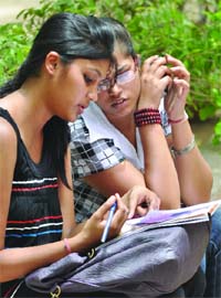 Students fill in admission forms at Delhi University