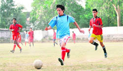 Players vie for the ball at theLala Nami Das District Football League being played at Pavillion Grounds in Dehradun on Friday.