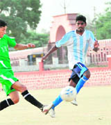 A match in progress at the match organised by the District Football Association in Dehradun on Friday.