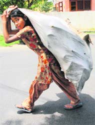 A girl on her way to scrap dealer after days work