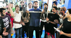 A participant in action during a biceps competition at a club in Ludhiana