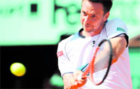 Robin Soderling returns the ball to Tomas Berdych during their men's semi-final in Paris on Friday