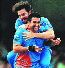 Bollywood actors Sohail Khan and Aftab Shivadasani (front) celebrate a wicket during a charity cricket match between IIFA XI and Sangakkara's XI as part of the three-day International Indian Film Academy awards in Colombo on Friday. 