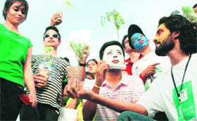 Activists of Global Environment Concern observe the World Environment Day at the Sector 17 Plaza in Chandigarh on Saturday.