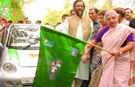 Delhi Chief Minister Sheila Dikshit flags off a rally of battery-operated vehicles in New Delhi