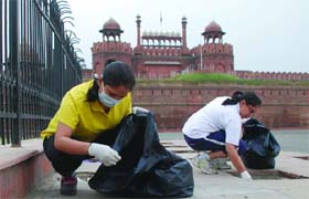 Employees of ICICI Bank clean the Red Fort to mark the day