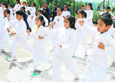 Karate trainees compete for belt grading in Mussoorie on Saturday.