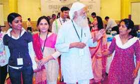 Veteran environmentalist Sunderlal Bahuguna talks to young girls on the sidelines of a World Environment Day function in Dehradun on Saturday.