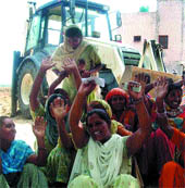 Women protest against the administration in Chainia village on Saturday