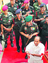 Defence Minister AK Antony inaugurates a housing project as Army chief VK Singh and other officers look on at Armys Central Command in Lucknow on Saturday.