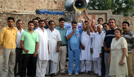 The members of NGO Social Welfare Society bring out a Prabhat Pheri in Kanshi Ram locality to motivate the people to save water and protect environment through a public address system