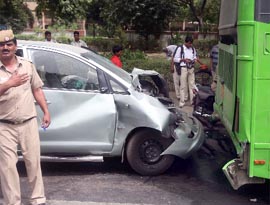 Three persons were injured as an Innova car hit a low-floor bus at Sardar Patel Marg in New Delhi on Sunday.
