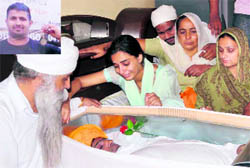 Relatives mourn the death of Bipranbir Singh (inset)