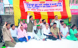 Palika ward members stage a dharna at Jhoola Ghar in Mussoorie on Monday