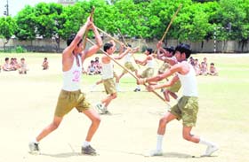 Boys perform on the concluding day of a training camp of the Arya Vir Dal at DAV Senior Secondary School in Karnal
