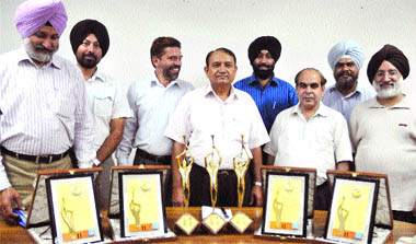 AIR staff display the awards, won at the International Radio Festival held in Iran, in Jalandhar on Monday.