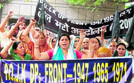 Refugees of DPs front protest for their demands for a comprehensive and permanent settlement package in Jammu on Monday
