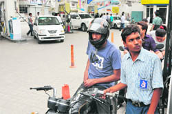 Anticipating rise in fuel prices, residents queue up at a petrol station in Ludhiana 