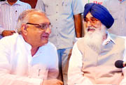 Haryana Chief Minister Bhupinder Singh Hooda and Punjab Chief Minister Parkash Singh Badal at the first meeting of the Working Group on Agriculture Production in Chandigarh on Monday