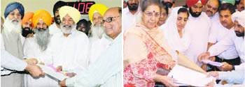Balwinder Singh Bhunder of the SAD (left) and Ambika Soni of the Congress file their nomination papers at the Punjab Vidhan Sabha in Chandigarh on Monday.