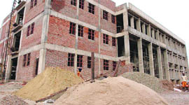 The construction work of a government building moves at a snails pace due to non-availability of white sand in Rajpura.