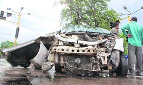 The mangled remains of a car, which collided with a bus, on the road separating Sectors 32 and 31 in Chandigarh