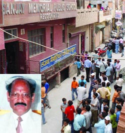 A crowd gathers in front of Sanjay Memorial Public School after its principal, Jagat Singh Chauhan (inset),  was found dead on Tuesday.