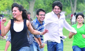 As mercury dips, boys and girls get in a playful mood at Rajpath in New Delhi on Tuesday.