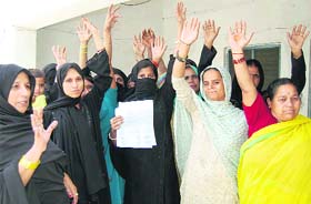 Muslim women protest against a local leader at the Jawalapur police station in Haridwar