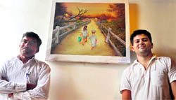 Sign board painter Om Parkash Kainth (left) with one of his works at MS Randhawa Art Gallery, PAU, Ludhiana