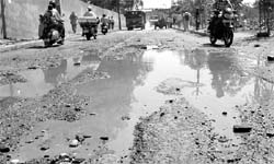 The damaged road after the rain near railway line at Phase-1 of Industrial Area in Panchkula on Wednesday
