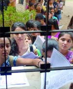 Students queue up to submit their admission forms at the Faculty of Arts in Delhi University on Wednesday