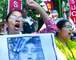The Socialist Unity Centre of India activists protest against the Bhopal gas tragedy verdict and demand the arrest of former Union Carbide chairman Warren Anderson, near Parliament in New Delhi on Wednesday