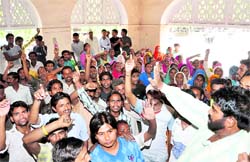 Safai Karamcharis of the DMC hold a protest in Dehradun on Wednesday